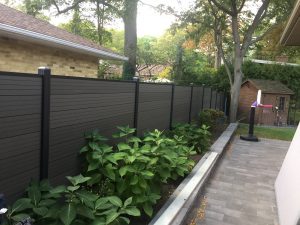 Backyard with black wood fence